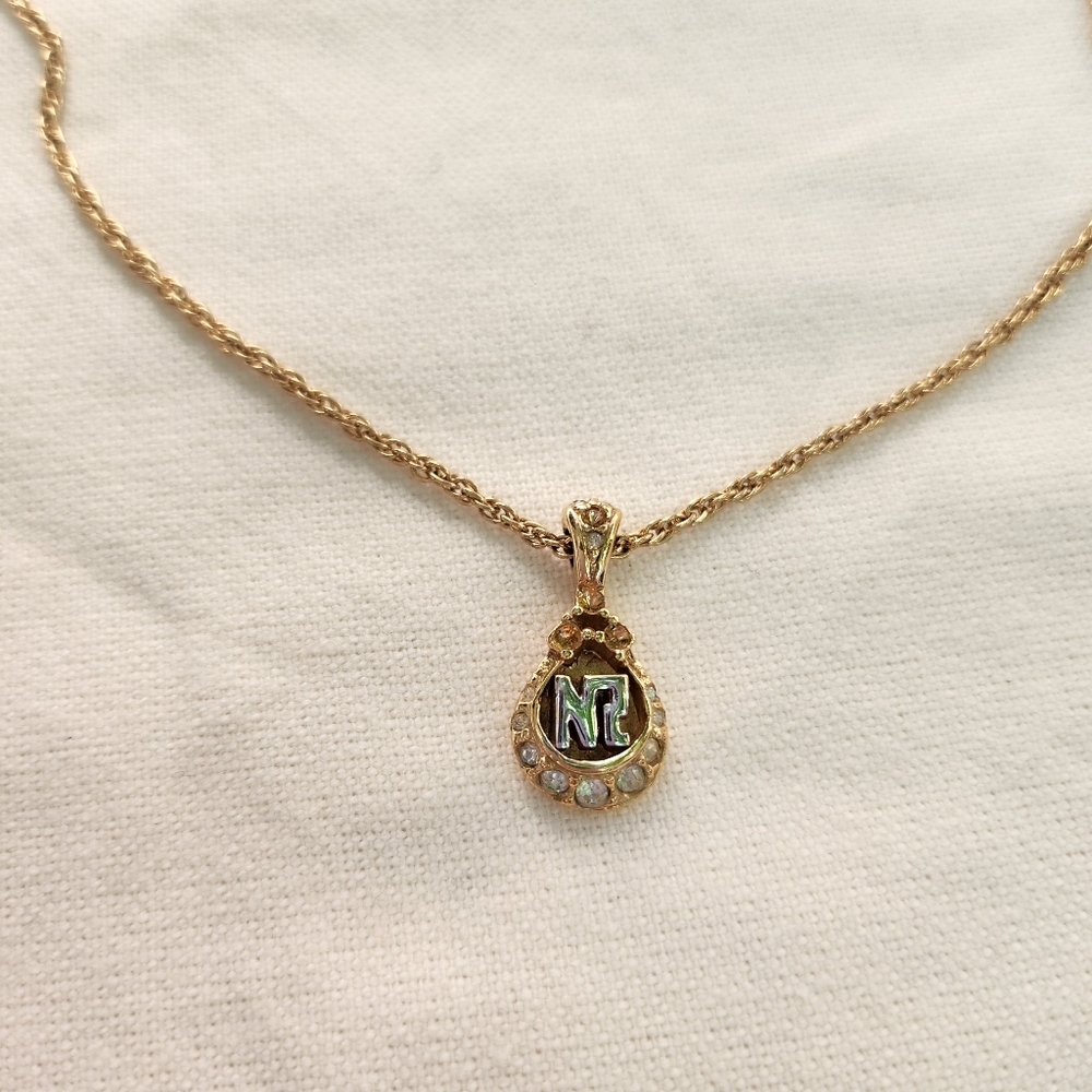 Nina Ricci Gold Tone Rhinestone pendant signed